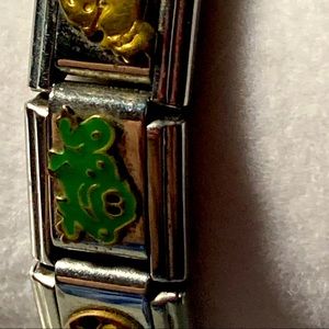 Vintage charm bracelet with hat baby carriage and frog. Silver tone. .#1764